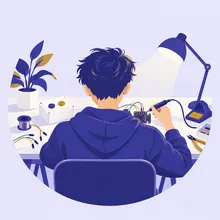 作業机で基板を組み立てる後ろ姿のイラスト
